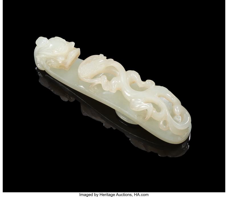 A Chinese Carved Pale Celadon Jade Dragon Belt Hook