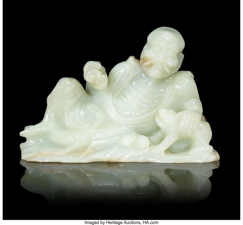 A Chinese Carved Pale Celadon Jade Reclining Figure of Luohan