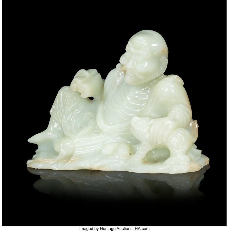 A Chinese Carved Pale Celadon Jade Reclining Figure of Luohan - 图2