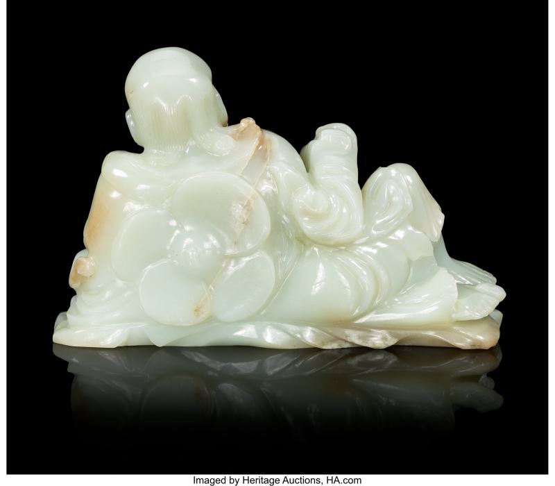 A Chinese Carved Pale Celadon Jade Reclining Figure of Luohan - 图3