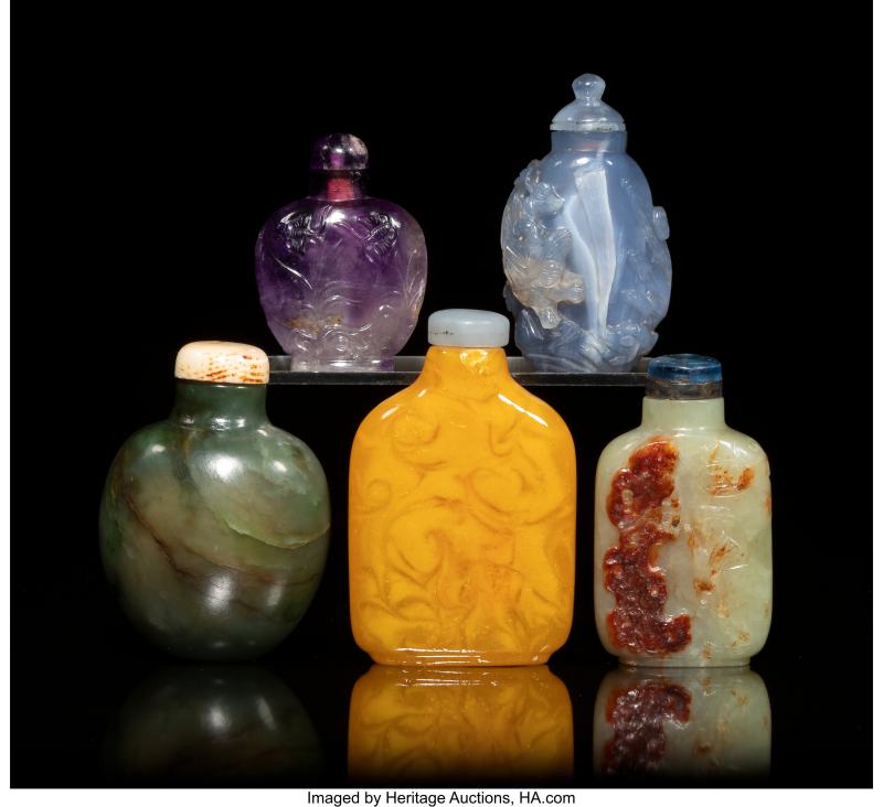 A Group of Five Chinese Carved Jade and Hardstone Snuff Bottles