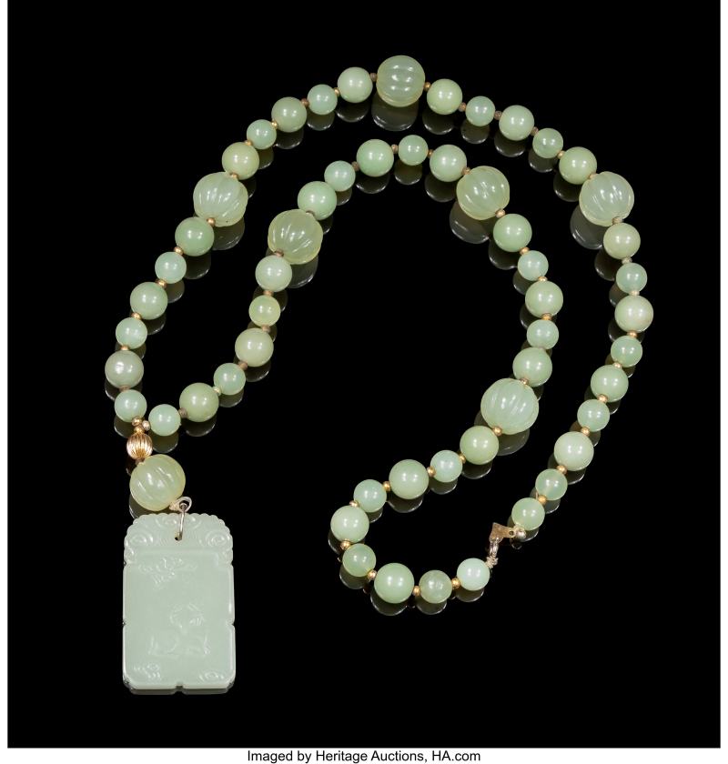 A Chinese Celadon Jade 'Ram' Plaque with Serpentine Bead Necklace