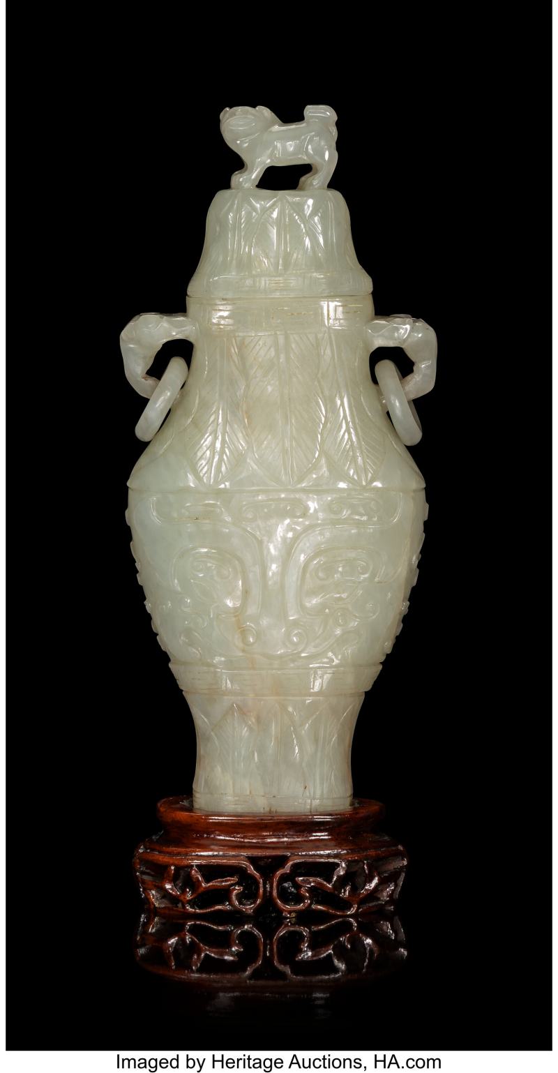 A Chinese Carved Celadon Jade Double-Handled Vase with Cover