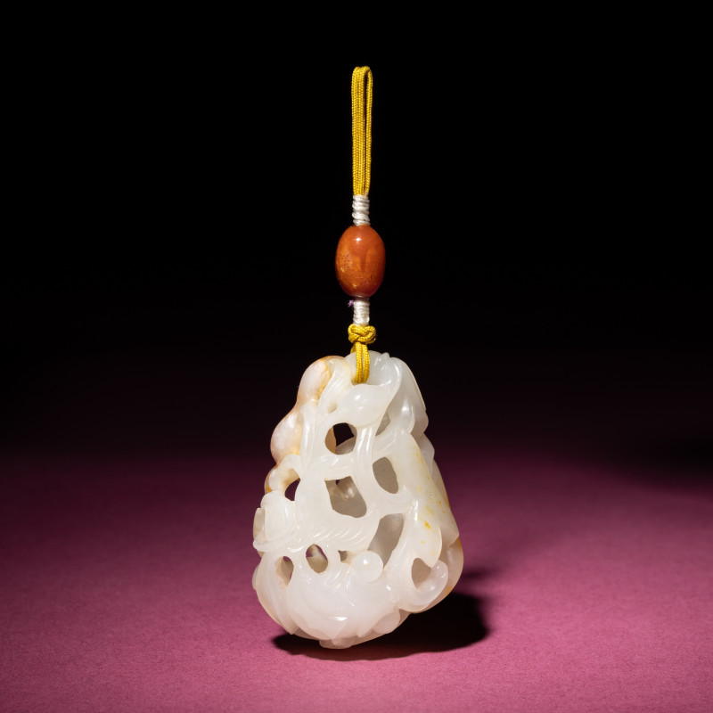 清中期 白玉帶皮鏤雕蓮紋佩 | A Chinese Russet and White Jade Reticulated 'Lotus' Pendant, 18th/19th Century