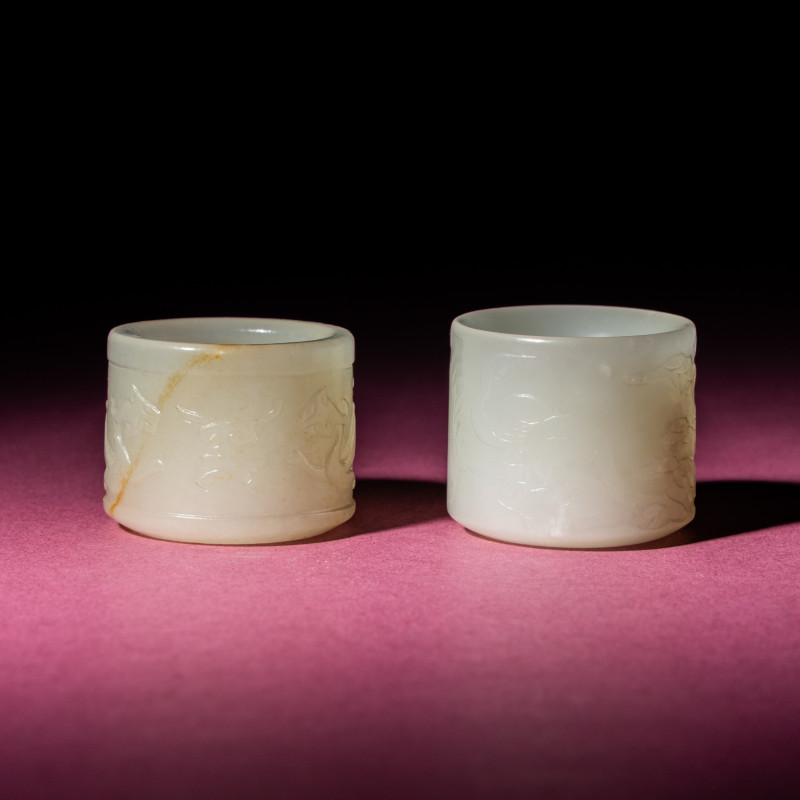 清中期 白玉刻動物紋扳指兩枚 | Two Chinese White Jade 'Animal' Archer's Rings, 18th Century