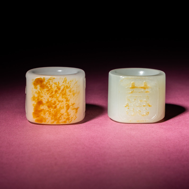 清中期 白玉留皮扳指兩枚 | Two Chinese Jade Archer's Rings, 18th/19th Century