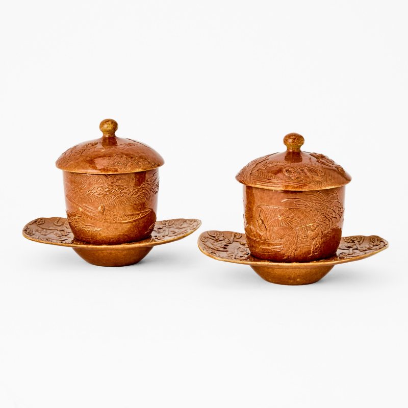 A Pair of Chinese Brown Glazed Porcelain Teacups and Stands