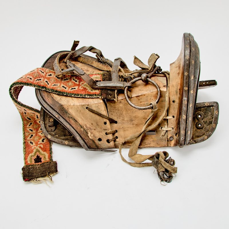 A Tibetan Wood, Inlaid Iron, and Shagreen Saddle