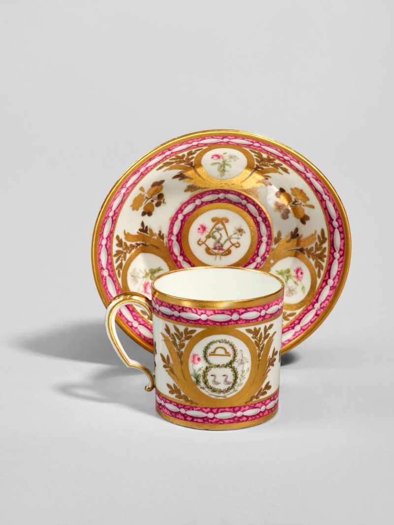 A Sèvres (Hard-Paste) Porcelain Faux Marbre-Ground 'Dauphin' Cup  and Saucer (gobelet litron et soucoupe), circa 1781