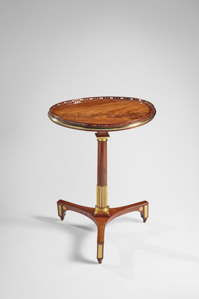 A German Neoclassical GIlt Bronze and Brass Mounted Mahogany Tripod Table by David Roentgen, Circa 1785