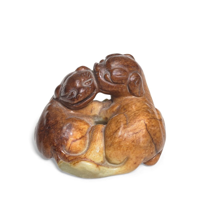 清 褐青玉雕佛獅把件 | A PALE GREEN AND RUSSET JADE 'LIONS' GROUP