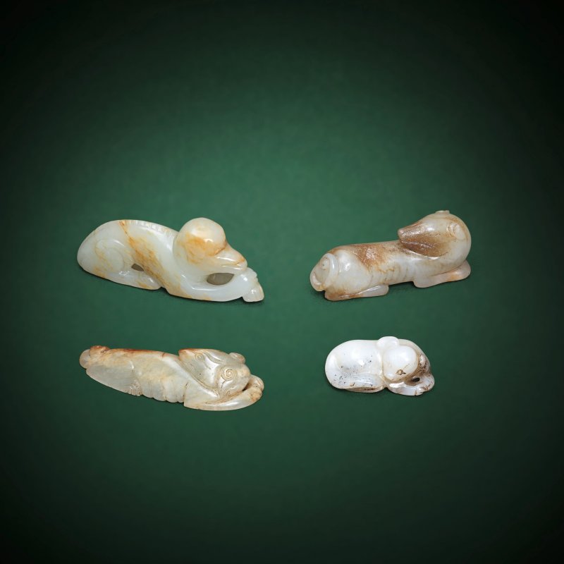 或宋及更晚 玉雕犬一組四件 | A GROUP OF FOUR RECUMBENT HOUND CARVINGS
