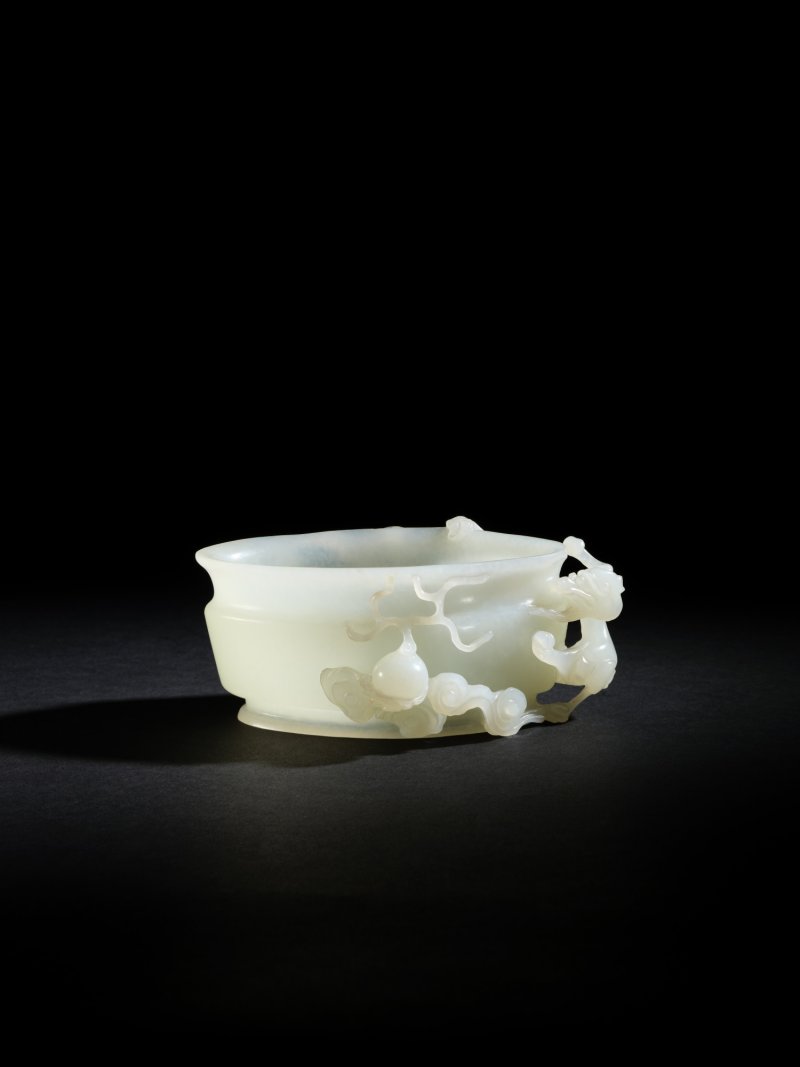 A white jade oval-form high-relief carved ‘dragon’ washer, Qing dynasty, 18th century | 清十八世紀 白玉鏤雕螭龍橢圓形洗