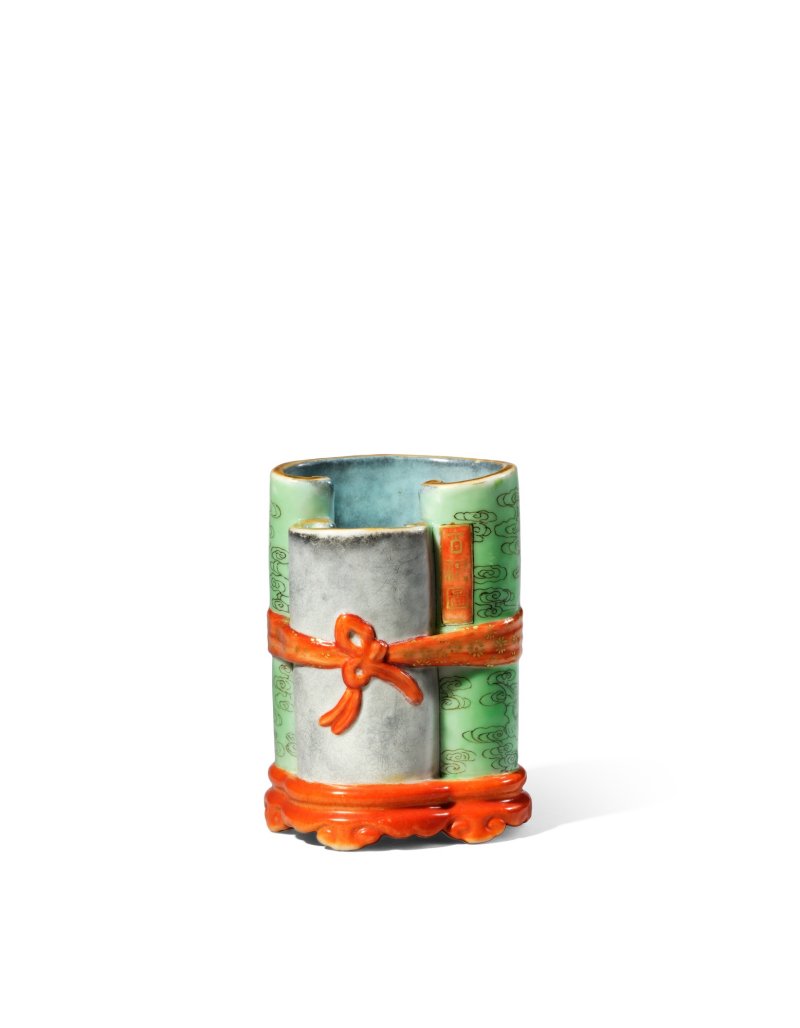 A fine and small famille-rose scroll-form brushpot, Seal mark and period of Qianlong | 清乾隆　粉彩軋道描金百福圖書卷袱系式筆筒　《乾隆年製》款
