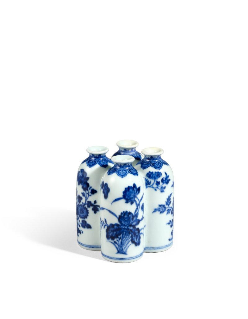 A rare blue and white ‘flowers of the four seasons’ conjoined vase, Seal mark and period of Qianlong | 清乾隆　青花四季花卉紋四聯瓶　《乾隆年製》款