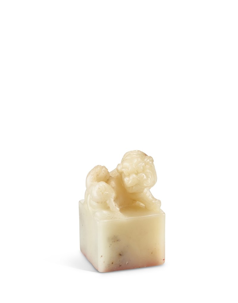 An imperial soapstone 'mythical beast and cub' seal Qing dynasty, Jiaqing period | 清嘉慶 御製壽山石獅鈕方璽 印文：毓慶宮寶