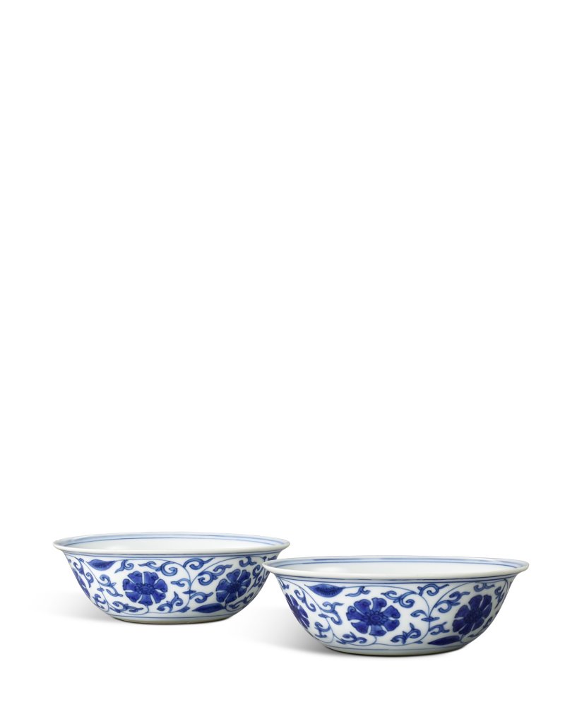 A  pair of blue and white 'floral scroll' bowls, Marks and period of Wanli | 明萬曆　青花外纏枝花卉內番蓮紋盌一對　《大明萬曆年製》款