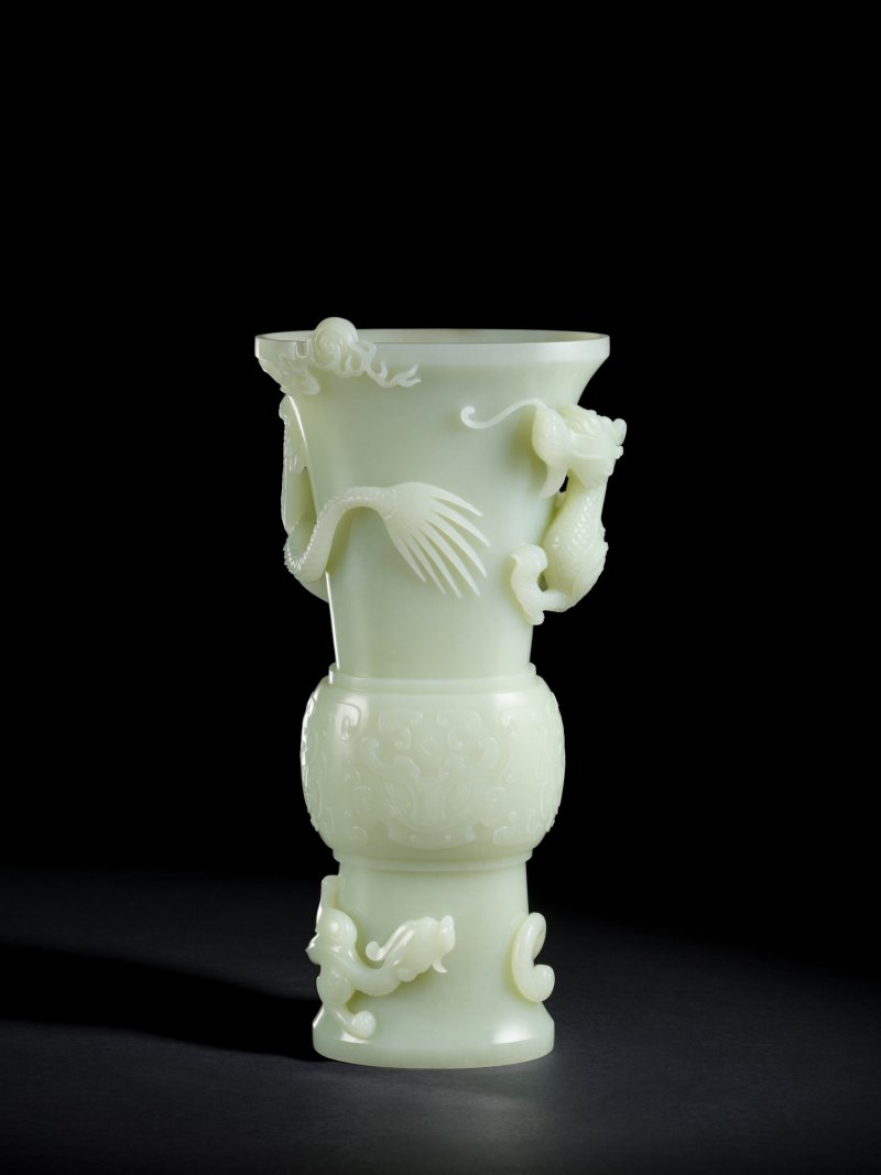 A large finely carved white jade 'dragon' archaistic vessel, Gu, Qing dynasty, Qianlong period | 清乾隆　白玉雙龍戲珠紋花觚