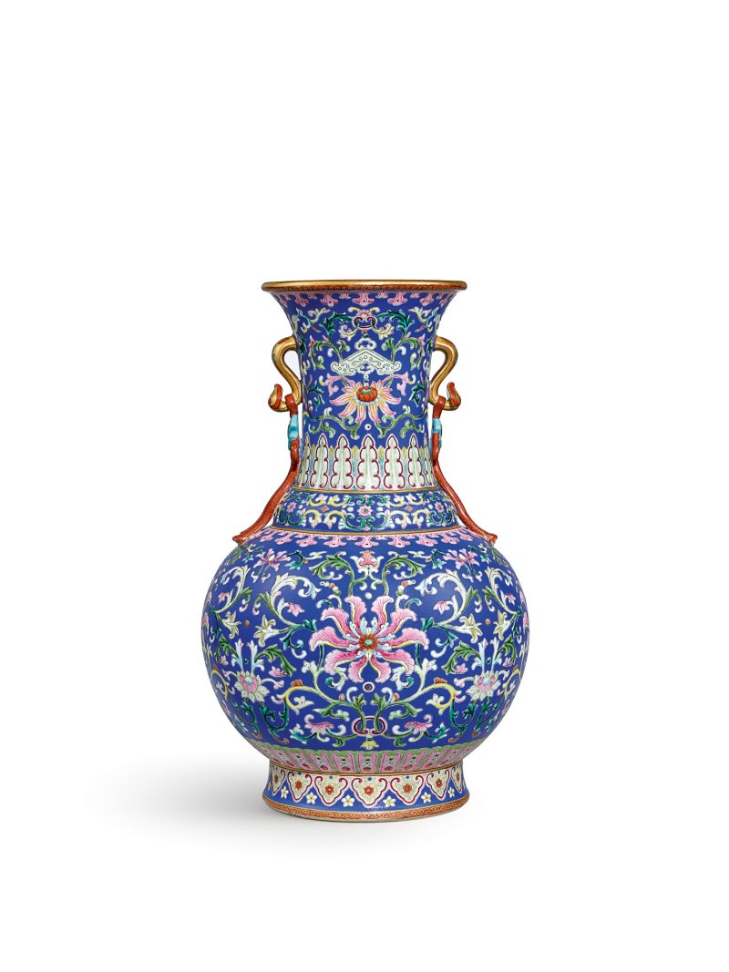 A magnificent and extremely rare yangcai blue-ground 'lotus’ ruyi-handled vase, Seal mark and period of Qianlong | 清乾隆　洋彩藍地番蓮紋如意耳瓶　《大清乾隆年製》礬紅款