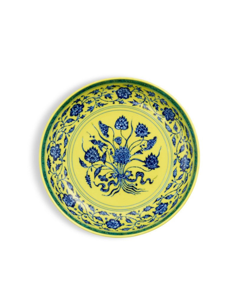 A rare underglaze-blue and yellow-enamelled 'lotus bouquet' dish, Mark and period of Yongzheng | 清雍正　黃地青花一把蓮紋盤　《大清雍正年製》款