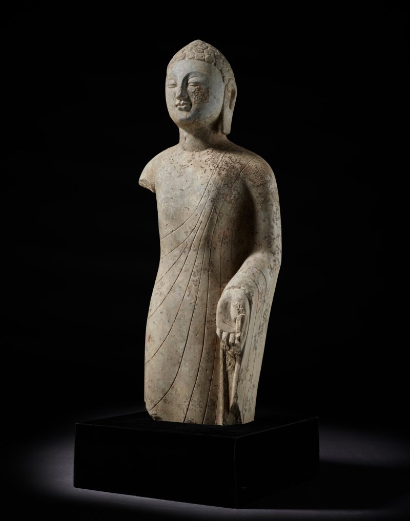 A rare carved limestone figure of Buddha, Northern Qi dynasty | 北齊 石雕立佛像