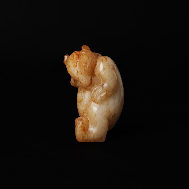 晚清 青白玉帶皮雕立熊把件 | A Chinese celadon and russet jade figure of a standing bear, late Qing dynasty