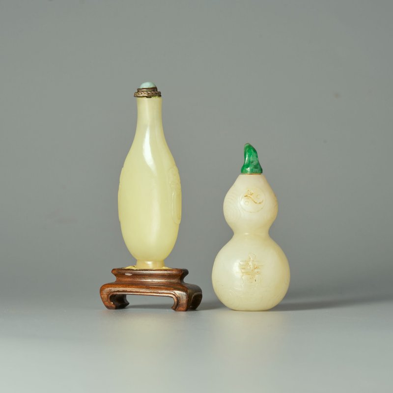 晚清 白玉匏形、黃玉鋪首銜環鼻煙壺二件 | A WHITE JADE 'DOUBLE GOURD' AND A YELLOW JADE SNUFF BOTTLE