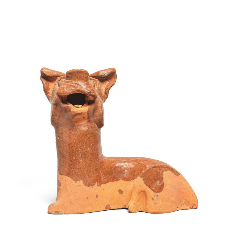 漢 褐釉臥犬 | A BROWN-GLAZED RECUMBENT DOG