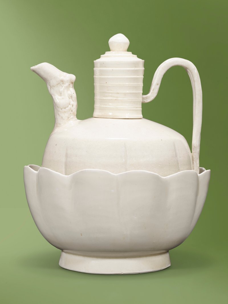 A RARE DING WHITE-GLAZED 'DRAGON' EWER AND COVER AND A WARMING BOWL  CHINA, NORTHERN SONG DYNASTY (960-1127)