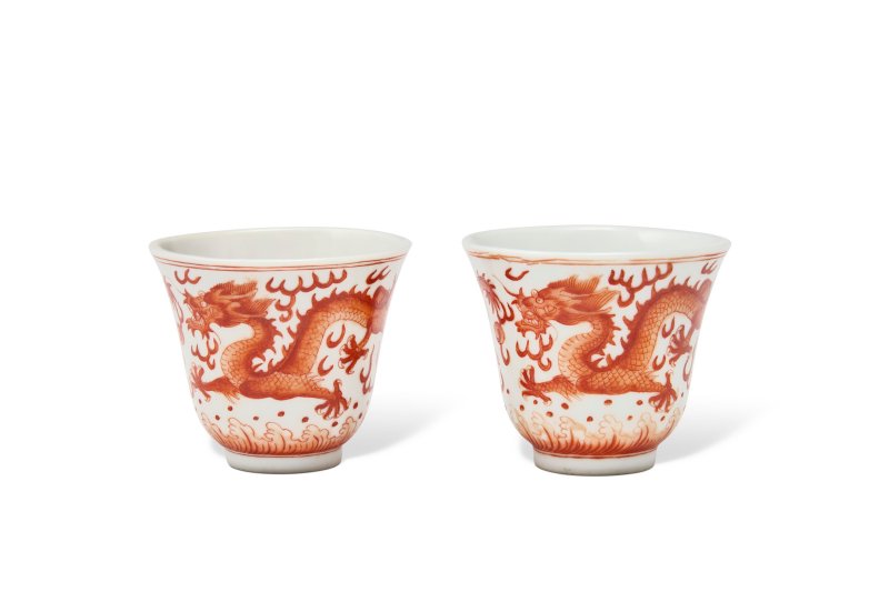 A PAIR OF IRON-RED-DECORATED 'DRAGON' CUPS  CHINA, QING DYNASTY, GUANGXU SIX-CHARACTER MARKS IN IRON-RED AND OF THE PERIOD (1875-1908)
