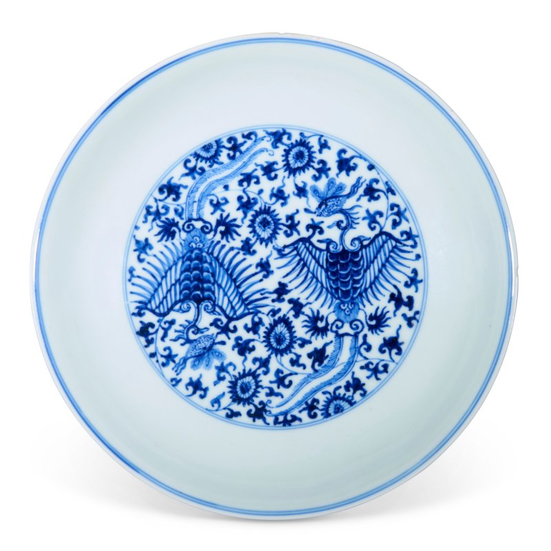 A BLUE AND WHITE MING-STYLE 'PHOENIX' DISH  CHINA, QING DYNASTY, KANGXI SIX-CHARACTER MARK WITHIN A DOUBLE CIRCLE IN UNDERGLAZE BLUE AND OF THE PERIOD (1662-1722)