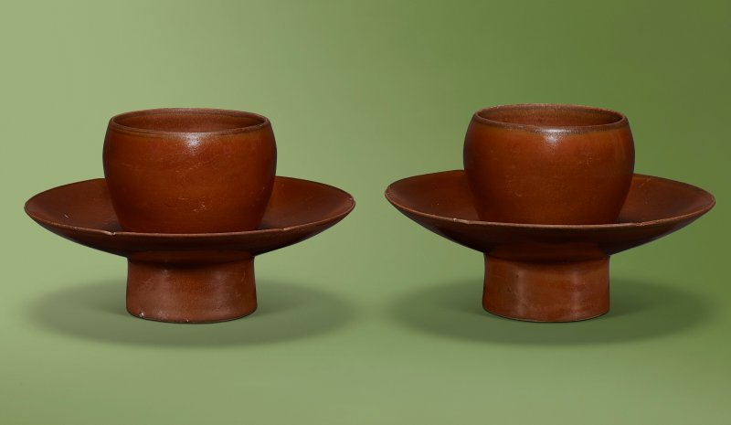 A PAIR OF DING PERSIMMON-GLAZED CUP STANDS  CHINA, NORTHERN SONG-JIN DYNASTY (960-1234)