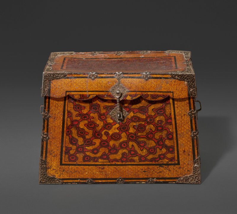 A WOOD AND LACQUERED LEATHER IRON BOND TRAVEL TRUNK  TIBET, 16TH CENTURY