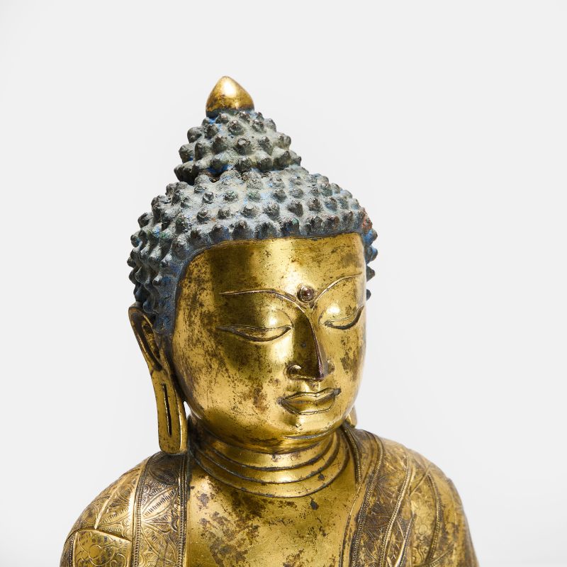 明(可能) 铜鎏金释迦牟尼坐像 | A Chinese gilt-bronze Shakyamuni Buddha probably Ming dynasty, seated crossed-legged