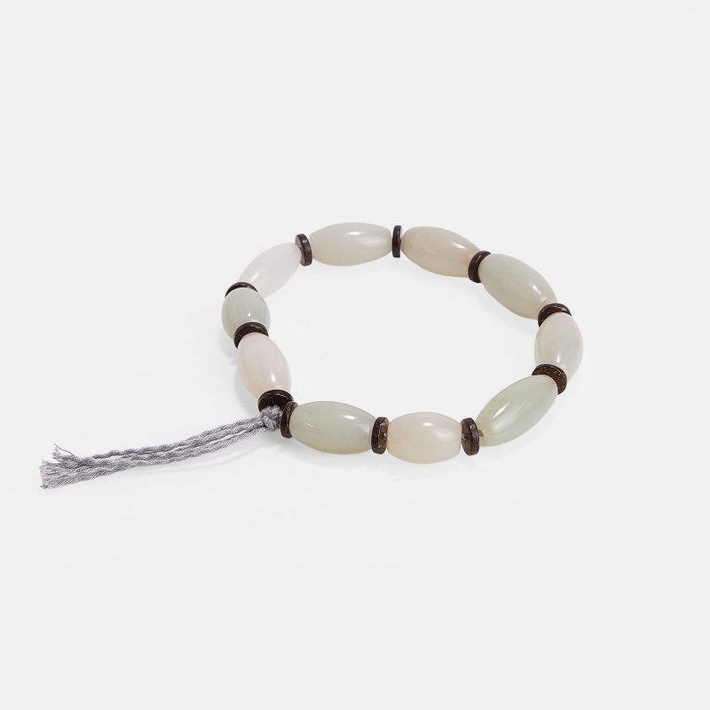 清 白玉手串 | A Chinese jade bracelet Qing dynasty (1644-1911), each bead of ovoid form