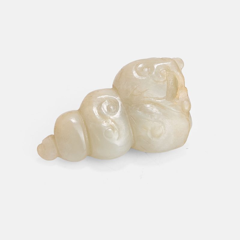 明 白玉螺女珮 | A Chinese jade pendant Ming dynasty (1368-1644), in the shape of a sea snail with a girl emerging from the top