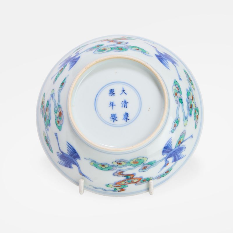清康熙 斗彩双龙抢珠纹碟 《大清康熙年制》青花楷书款 | A Chinese doucai dish Kangxi (1662-1722), the rounded sides rising from a circular foot to a flared rim