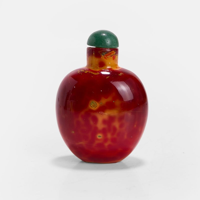 清十八至十九世纪 仿雄黄料胎鼻烟壶 | A Chinese realgar glass snuff bottle 18th-19th century, of gently tapering ovoid form with a concave base
