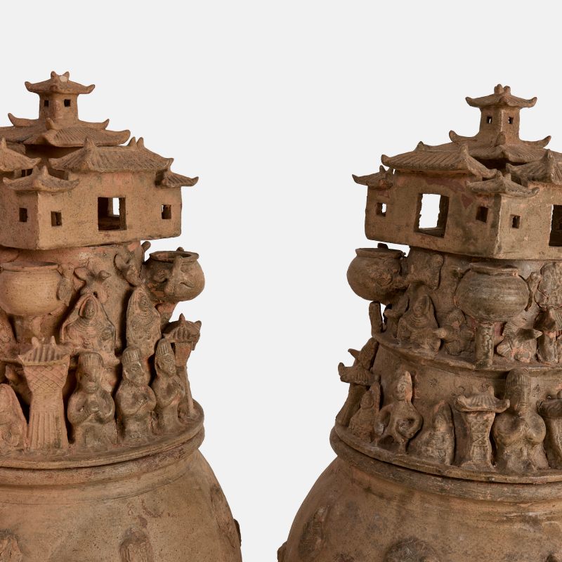 西晋 越窑神人楼阁纹青瓷魂瓶 一对 | A pair of rare Chinese Yue ware funerary urns (hunping) Western Jin dynasty (265-316), each well-potted ovoid stoneware body applied with three rows of moulded decoration