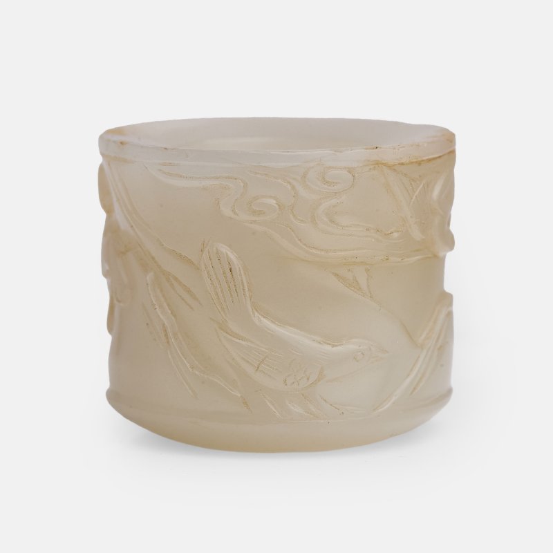 清 白玉欢天喜地图扳指 | A Chinese jade archer's ring Qing dynasty (1644-1911), of cylindrical form