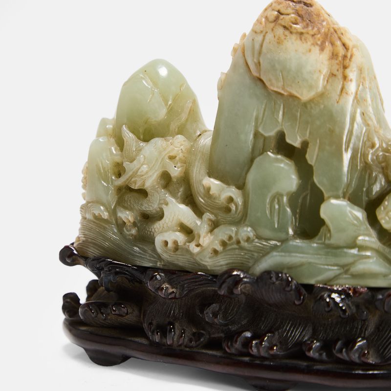 清 白玉龙虎纹笔架山 连木底座 | A Chinese jade brush rest Qing dynasty (1644-1911), of triangular shape with rounded peaks of varying heights in imitation of a mountain range