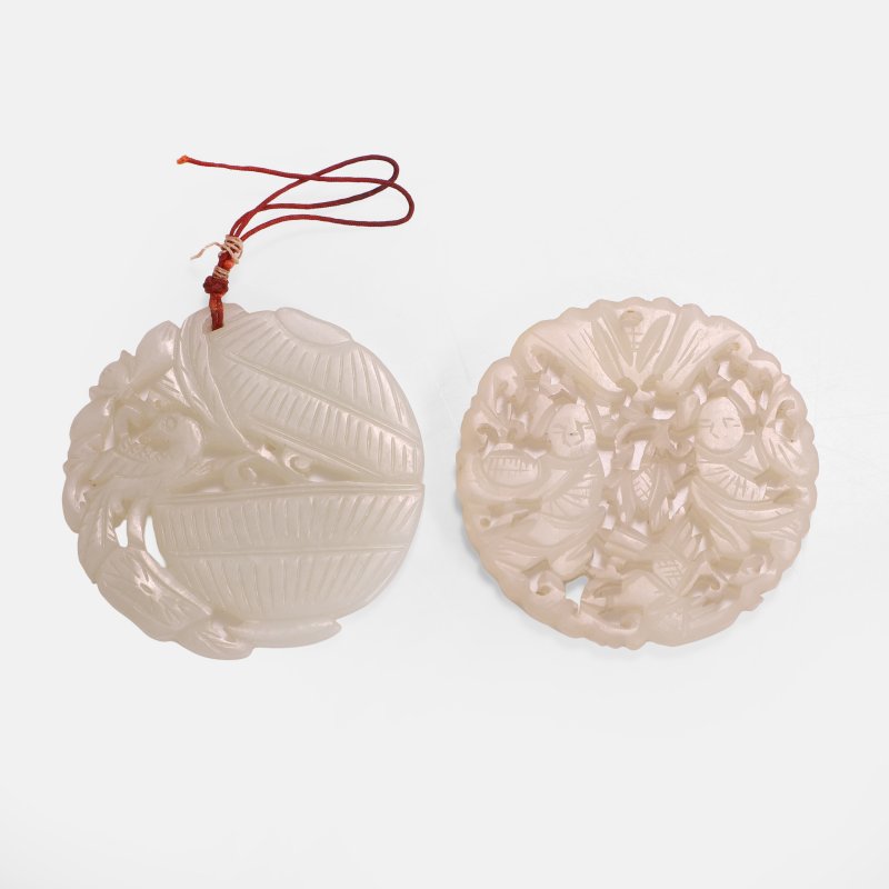 (2) | Two Chinese jade plaques 19th century, of circular form