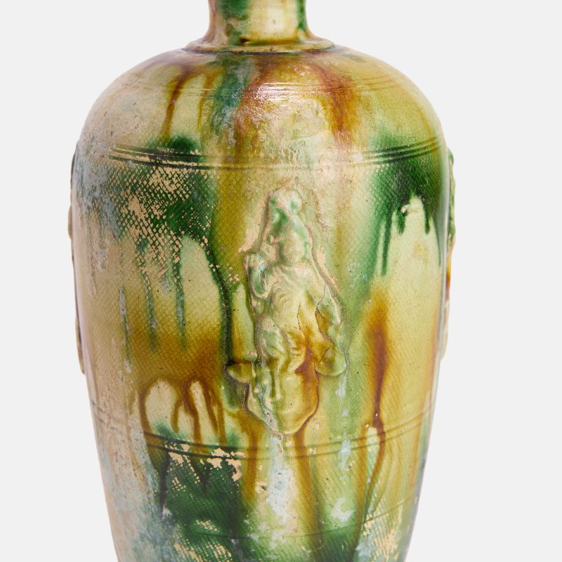 唐 三彩胡人乐舞瓶 | A Chinese sancai-glazed vase Tang dynasty (618-907), the tapering body rising to a tall rounded shoulder with an everted rim - 图1