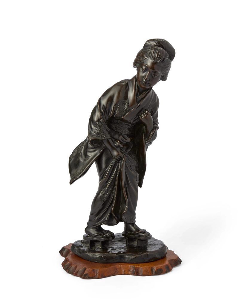 A Japanese bronze okimono of a geisha
