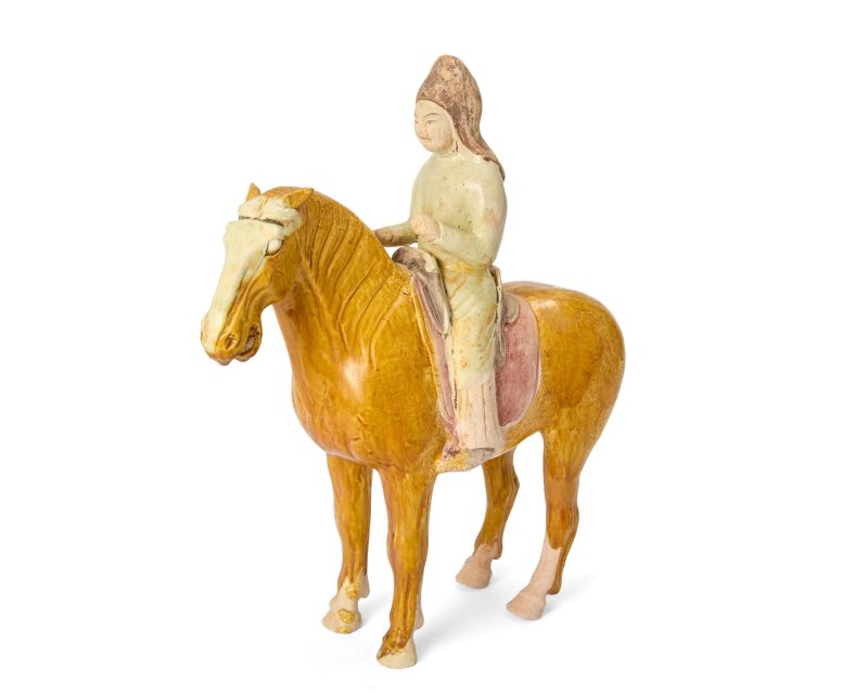 唐 黃釉騎馬俑 | A Chinese amber-glazed figure of a horse with straw-glazed and painted pottery foreign rider