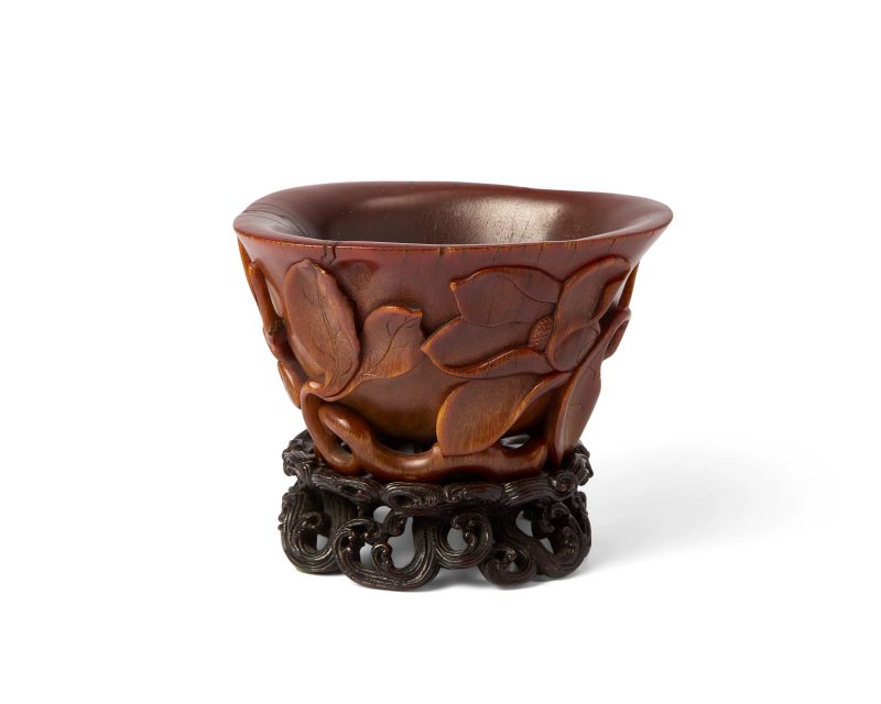 清十八世紀 犀角雕玉蘭紋杯連木座 | A Chinese ‘magnolia’ rhinoceros horn libation cup