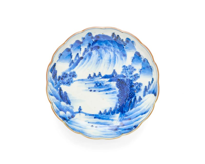 A Japanese Arita blue and white floral-rimmed dish