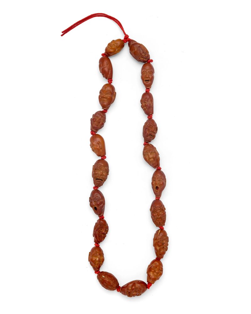 二十世紀 核雕十八羅漢首一串 | A Chinese twenty-bead hediao 'luohan' necklace