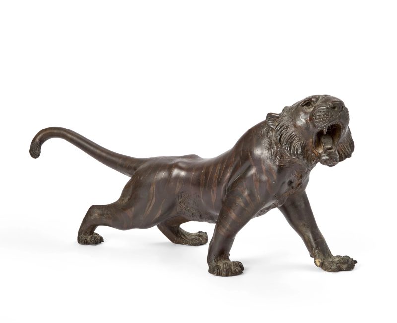 A large Japanese bronze okimono of a prowling tiger