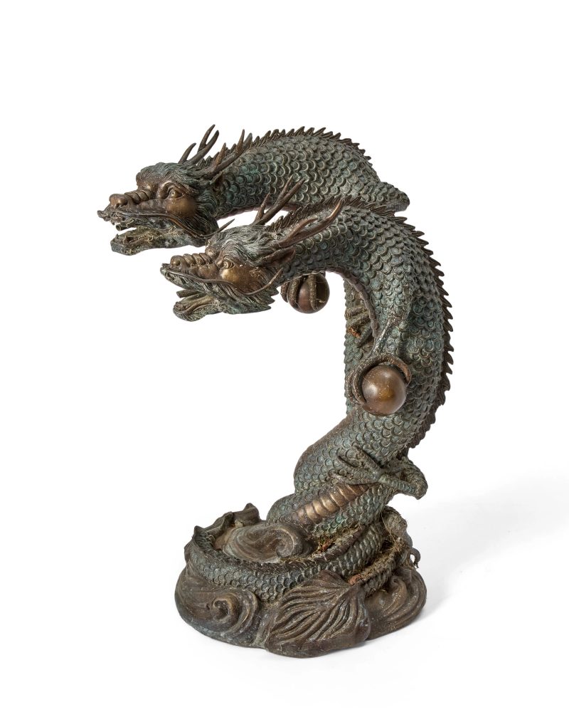 A huge Japanese bronze okimono of twin dragons